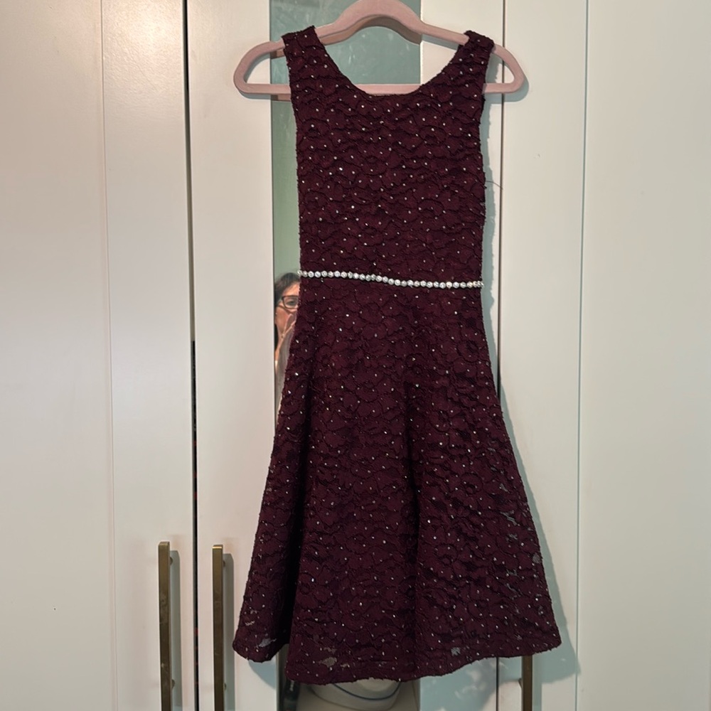 Burgundy dress with sequins and a sequin belt.  Size 10.  Like new.